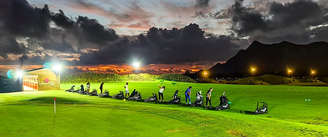 Floodlit Top Shots bays at night at The Range by Moka Rangers