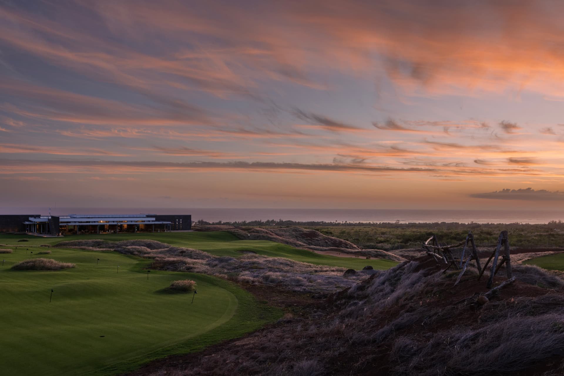 The La Réserve clubhouse at sunset